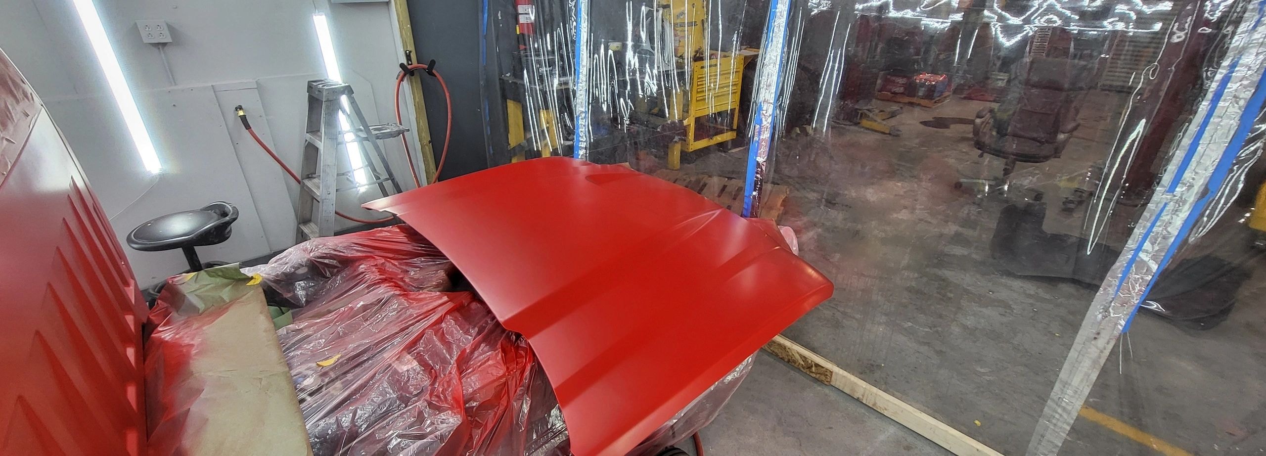 Detailed custom paint application on Chevy HD 2500 hood — auto body repair at C.A.R.S Cartersville GA